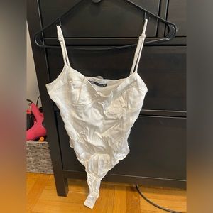 Zara white bodysuit with adjustable straps and snap closure